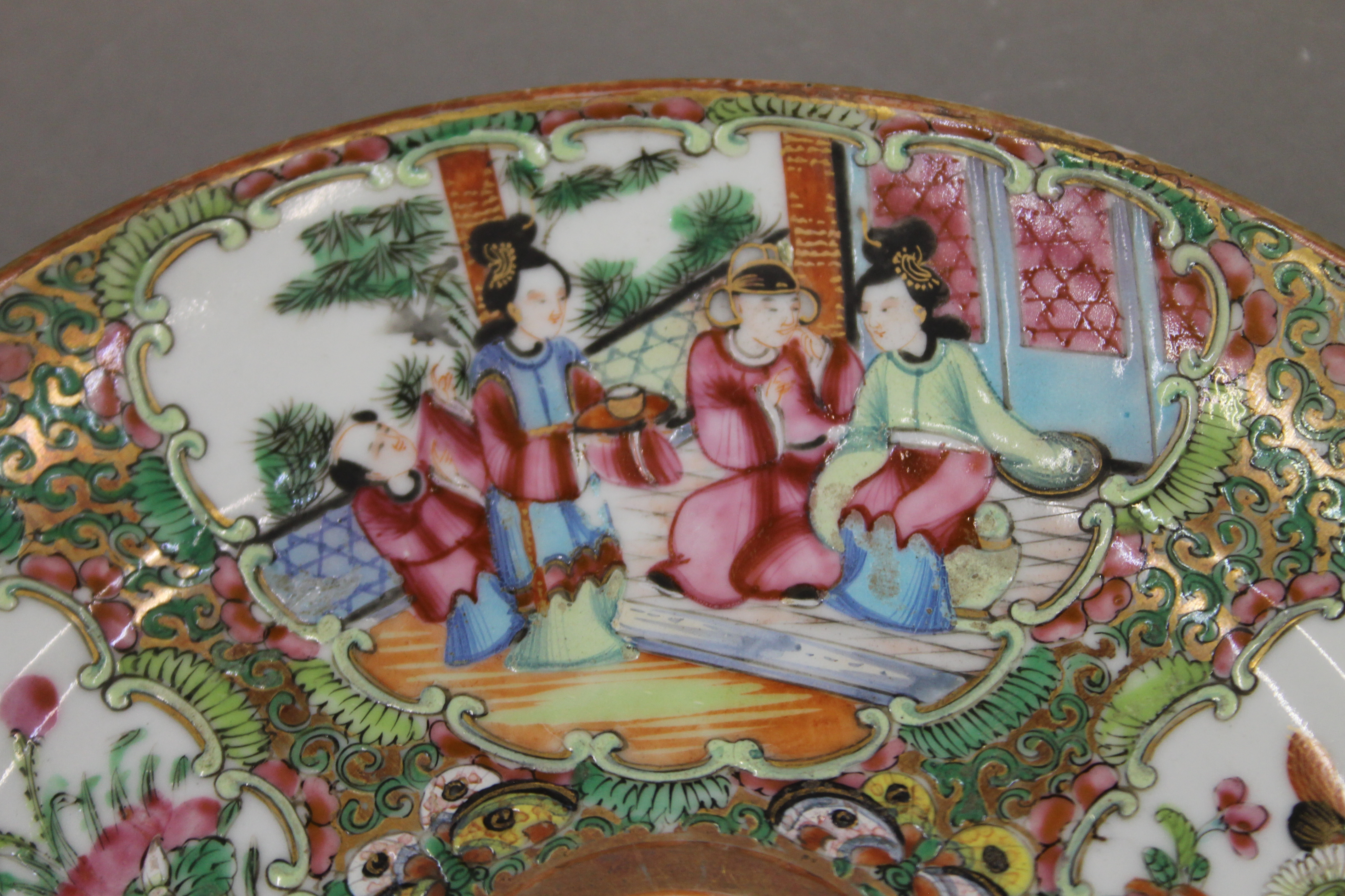 A 19th century Canton famille rose porcelain plate hand painted with attendants, birds, butterflies, - Image 5 of 6