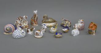 A collection of Royal Crown Derby paperweights.