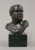 A bronze male bust. 13 cm high.