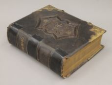 A large Victorian Bible with brass clasps.