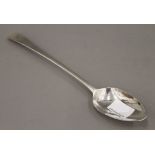 A Georgian silver serving spoon. 27.5 cm long. 84.6 grammes.