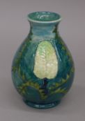 A Moorcroft Banksia vase. 18 cm high.