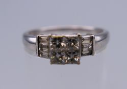 An Art Deco style 18 ct white gold and diamond ring. Ring size O/P. 3.2 grammes total weight.