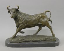 A bronze model of a bull. 36 cm long.