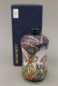 A boxed Moorcroft Gypsy bottle vase. 20 cm high.