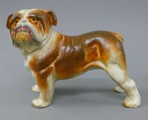 A cast iron doorstop modelled as a bulldog. 22 cm long.