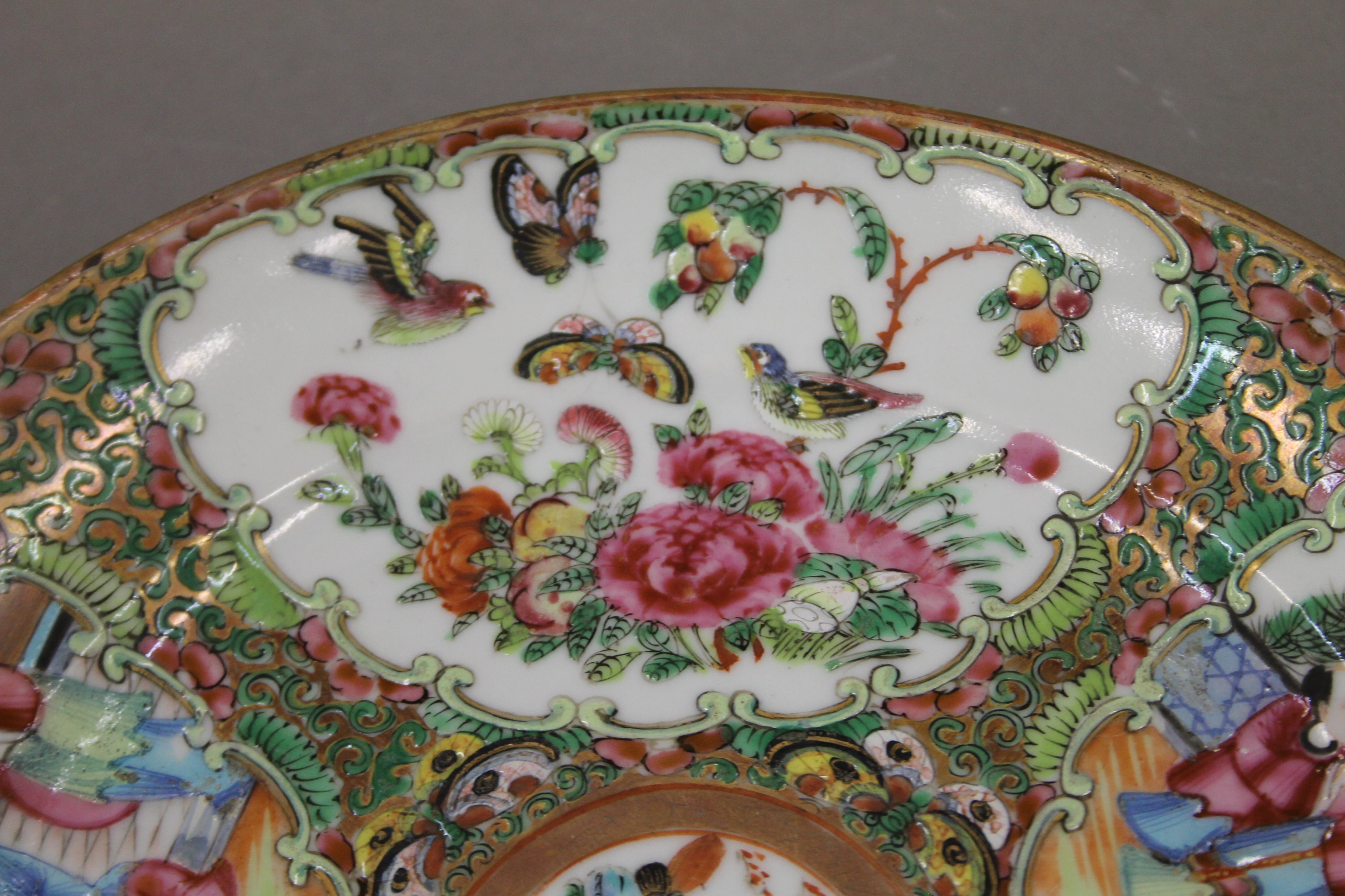 A 19th century Canton famille rose porcelain plate hand painted with attendants, birds, butterflies, - Image 4 of 6