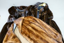 Three vintage mink coats.