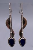 A pair of silver drop earrings. 5 cm high.
