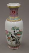 A Chinese porcelain vase hand painted with peacocks and calligraphy, with square seal marks to base.