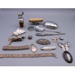 A quantity of silver jewellery to include bracelets, brooches, pendants, pocket knife, etc.