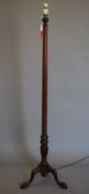 An early 20th century mahogany standard lamp. 157.5 cm high overall.