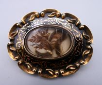 A Victorian unmarked gold and black enamel mourning brooch, the reverse inscribed AAC,