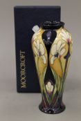 A boxed Moorcroft Athena vase, numbered 27/75. 20 cm high.