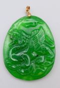 A jade pendant depicting a dragon. 5.5 cm high.