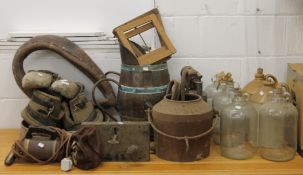 A quantity of various bygones, including a coal bucket, demi-johns, a vintage lock and key, clogs,