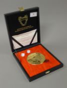 A boxed Kingdom of Bahrain Monetary Agency Commemorative gold plated silver medallion in a