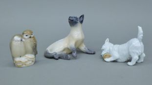 Three Royal Copenhagen models, a Siamese cat, a terrier pup and a pair of owls.