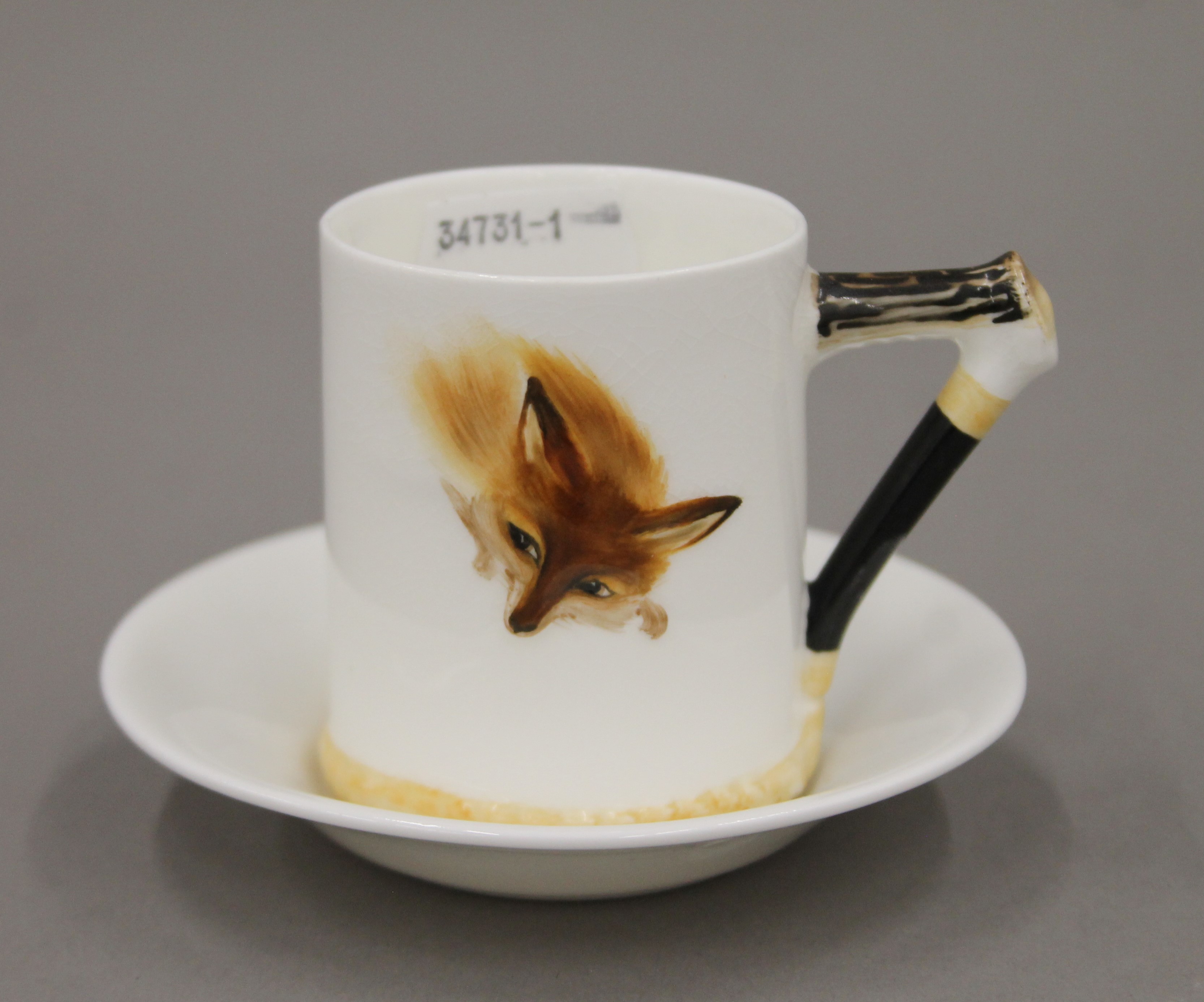 A Royal Doulton Reynard the Fox coffee can and saucer, and a cream jug. The latter 11 cm high. - Image 2 of 6