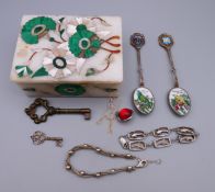 A marble box, containing two silver bracelets, a necklace, key and two enamel spoons. Spoons 11.