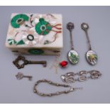 A marble box, containing two silver bracelets, a necklace, key and two enamel spoons. Spoons 11.