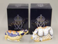 Two boxed Royal Crown Derby paperweights, White Rhino and Hippopotamus.