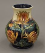 A Moorcroft Burdock vase. 14.5 cm high.