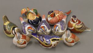 A collection of Royal Crown Derby bird form paperweights.