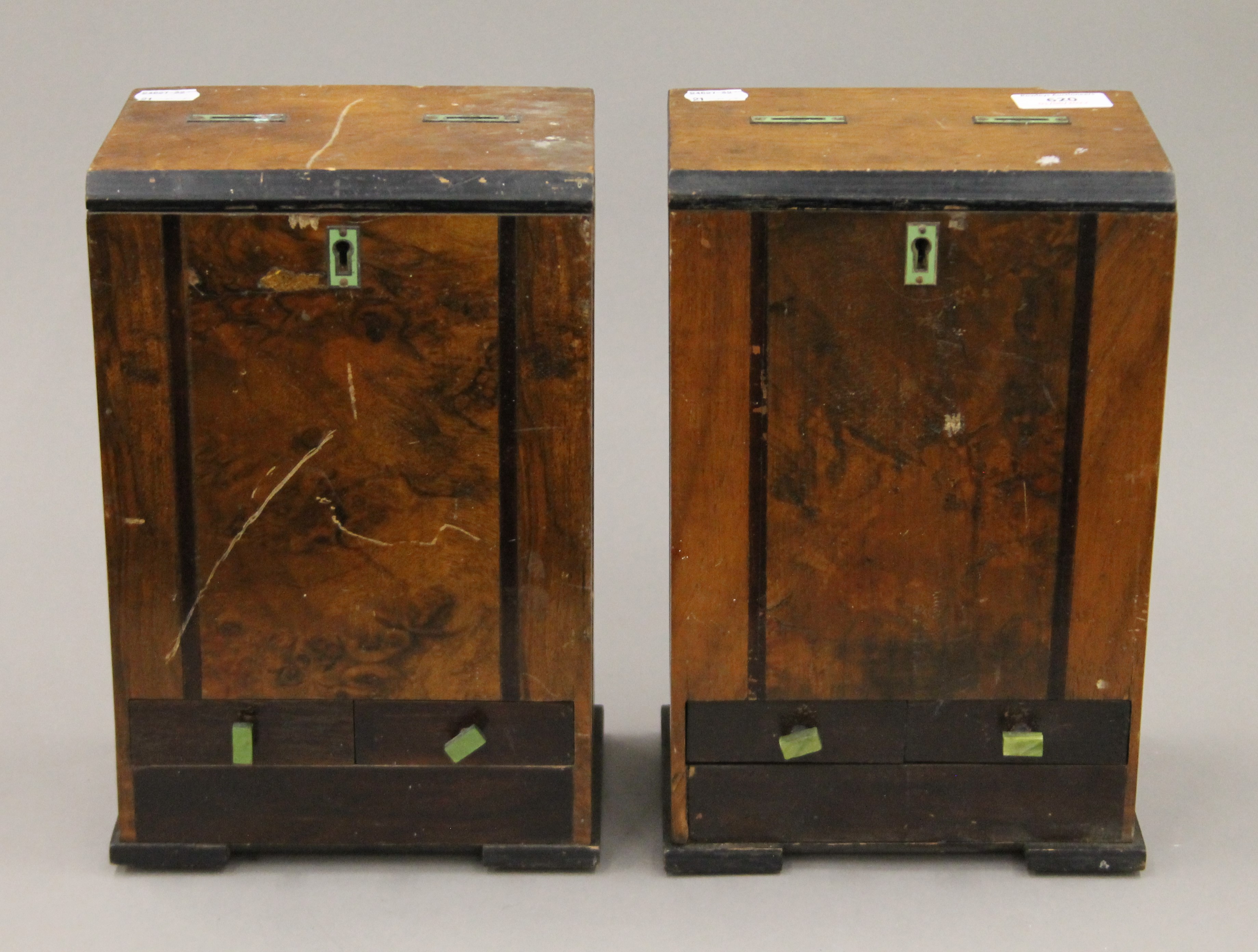 A pair of cigarette packet coin operated dispensers. 29.5 cm high.
