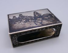 A Russian silver niello matchbox holder. 6 cm x 4 cm.