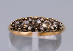 An Edwardian 18 ct gold diamond ring. Ring size L/M. 3 grammes total weight.