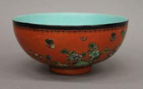 A Chinese porcelain bowl with orange ground exterior. 13.5 cm diameter.