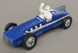 A cast iron Michelin racing car. 25 cm long.