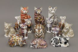 A collection of Royal Crown Derby cat form paperweights.