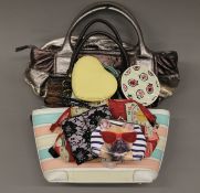 A quantity of various handbags and purses.