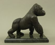 A bronze model of a gorilla. 20 cm long.