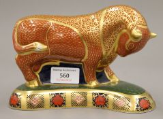 A Royal Crown Derby Harrods Bull paperweight. 19 cm long.