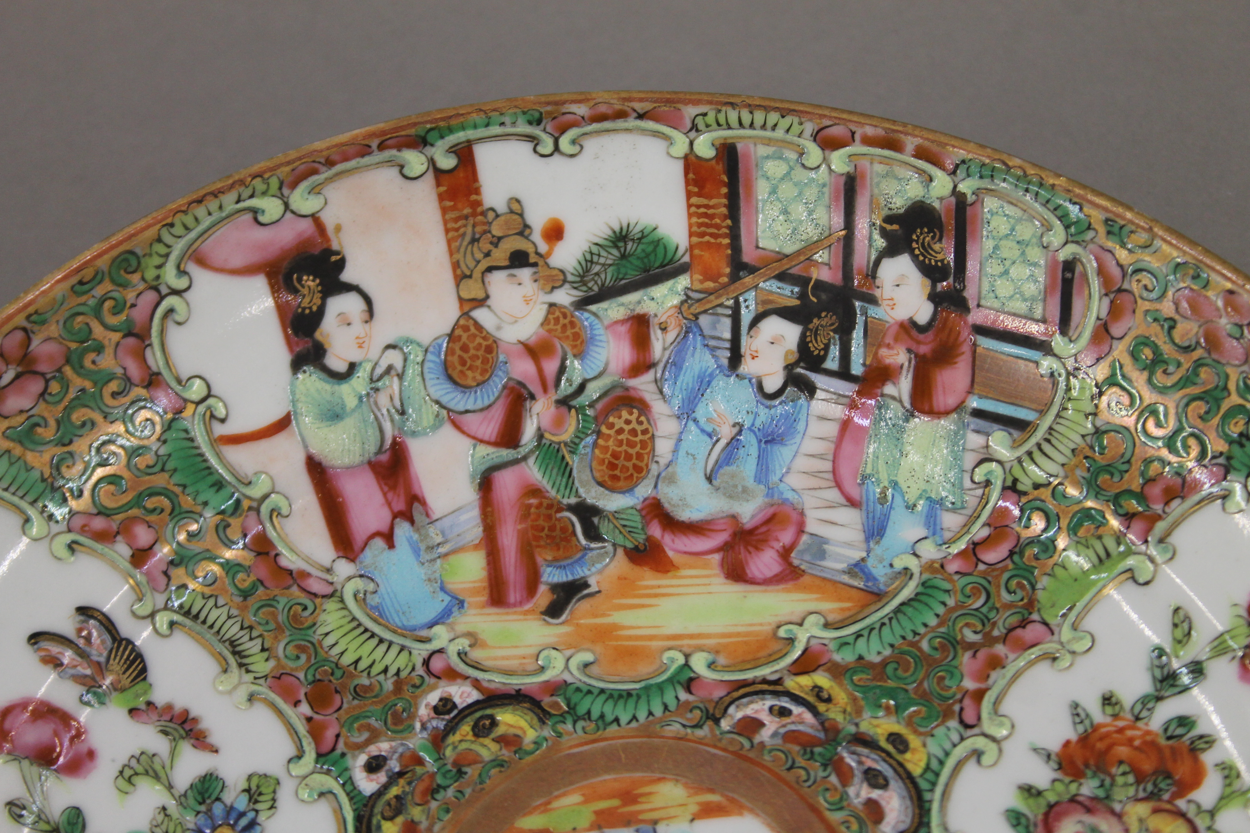 A 19th century Canton famille rose porcelain plate hand painted with attendants, birds, butterflies, - Image 3 of 6