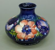 A William Moorcroft Pansy pattern onion vase. 12 cm high.