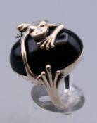 A silver onyx frog ring. Ring size R/S.