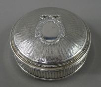 A French silver box. 9.5 cm diameter. 141.7 grammes.