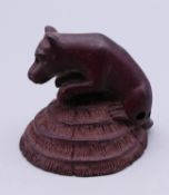 A netsuke formed as a dog. 4.5 cm high.