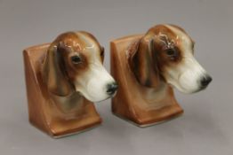 A pair of porcelain dog form bookends. 11.5 cm high.