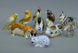 A collection of Royal Crown Derby paperweights.