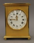 A brass mantle clock. 16.5 cm high.