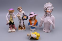 Five small Continental porcelain figures. Largest 12 cm high.