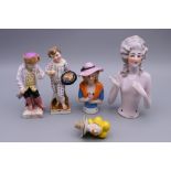 Five small Continental porcelain figures. Largest 12 cm high.