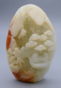 A white jade pebble carving. 7 cm high.