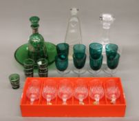 A boxed set of six lead crystal glasses, eight green sherry glasses,