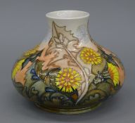 A Moorcroft Dandelion vase, numbered 198/200. 15 cm high.